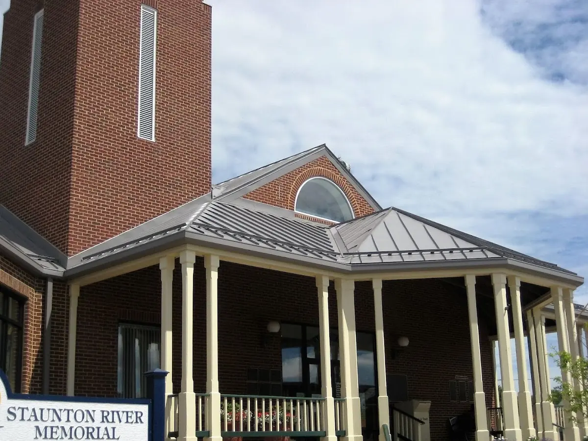 Skilled roofing craftsmen working on a residential roof in Fairhope